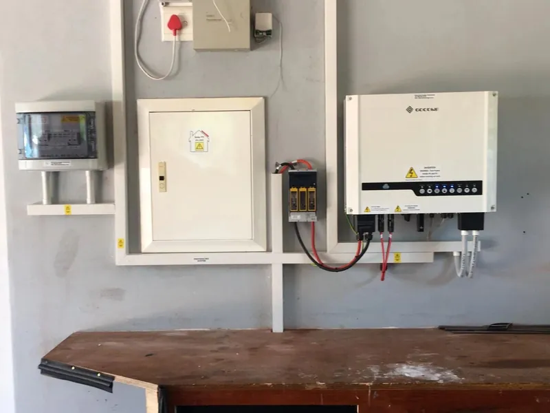 Hybrid inverter installed beside a distribution board with DC isolators and surge protection